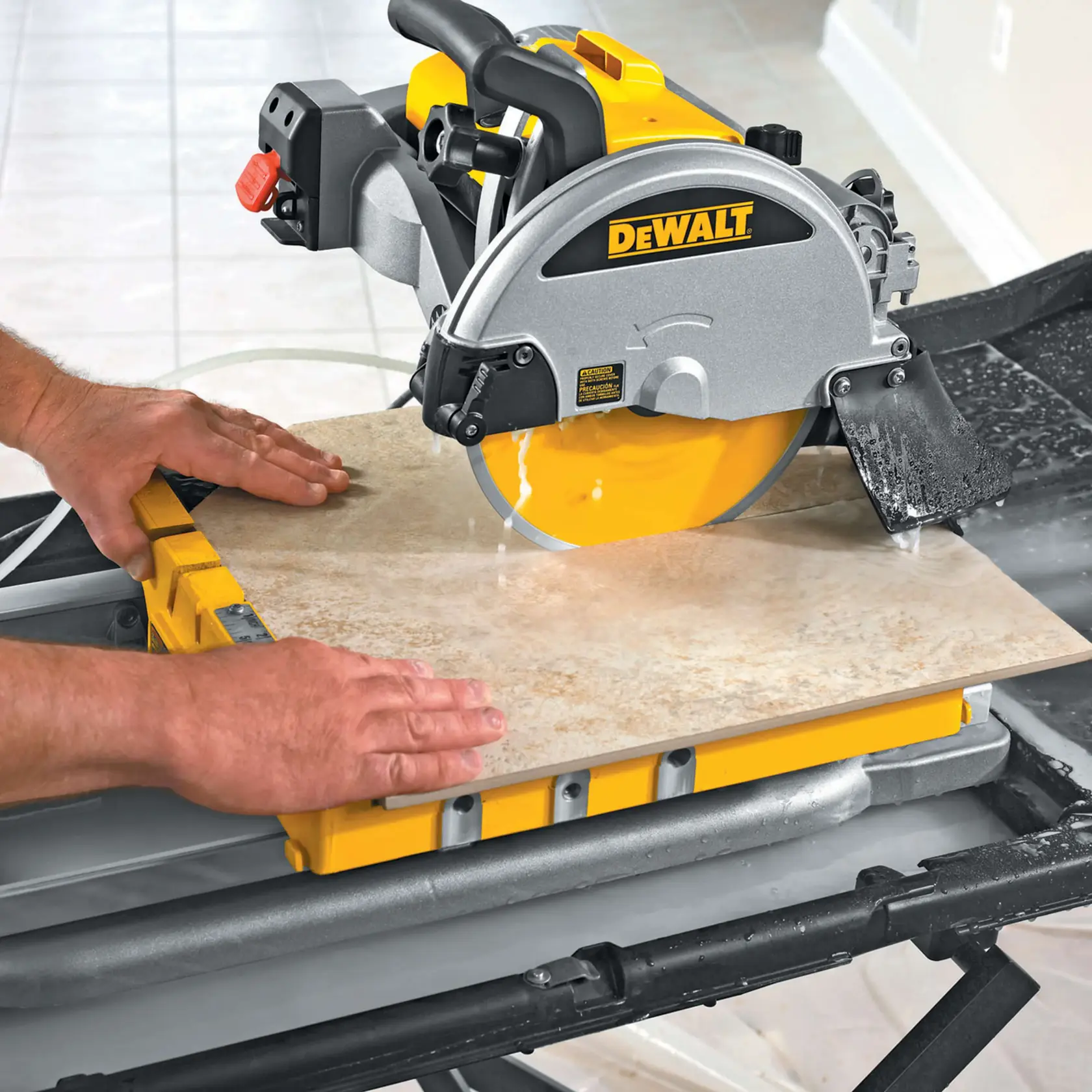 Person carrying DEWALT D24000 tile saw stand frame up a staircase with protective coverings on the steps.