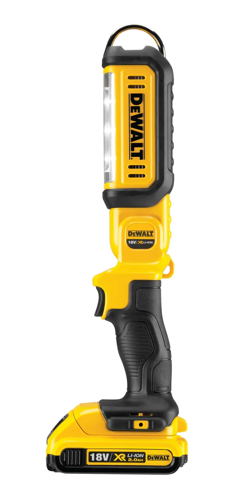 A person is kneeling and working on an open electrical unit, using tools. On the floor is a DEWALT DCL050 portable LED work light, illuminating the workspace.
