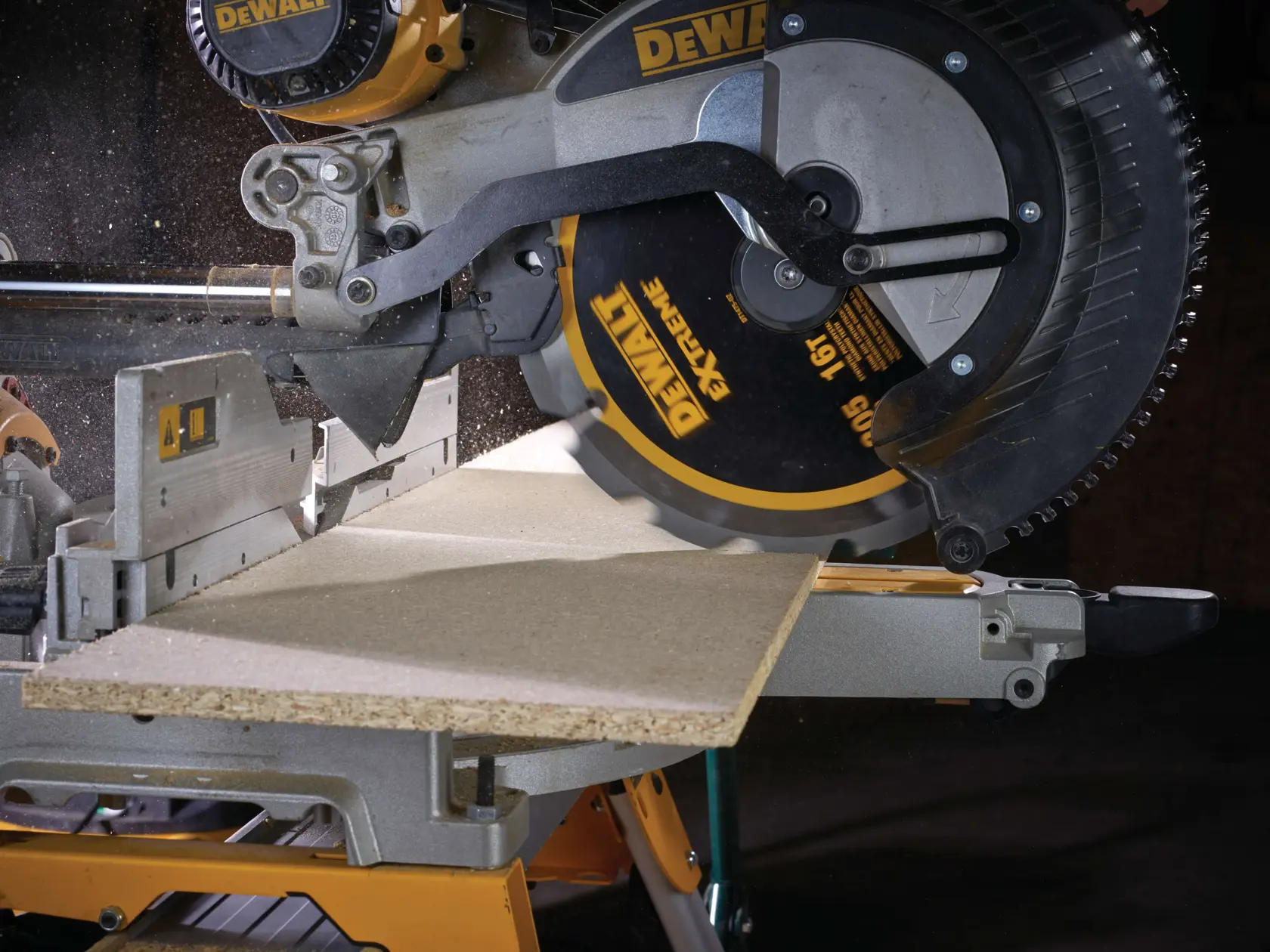 DEWALT circular saw cutting a piece of wood on a workbench, with sawdust visible.