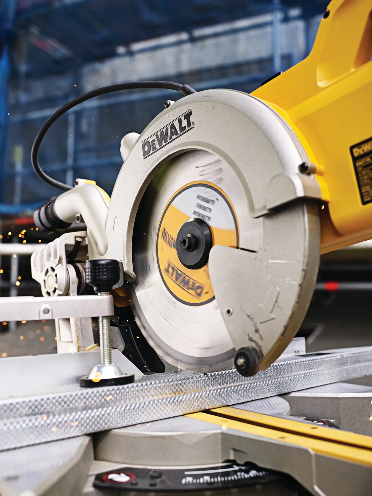DEWALT circular saw cutting metal material, with sparks flying during operation.