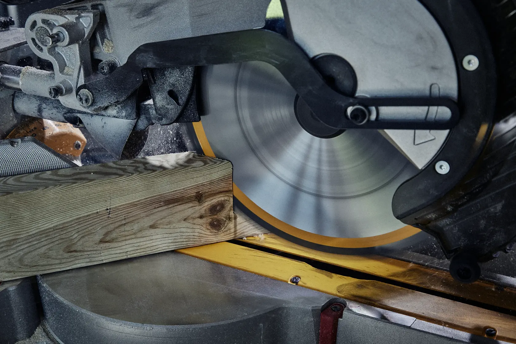 Close-up of a circular saw cutting a wooden plank with precision.