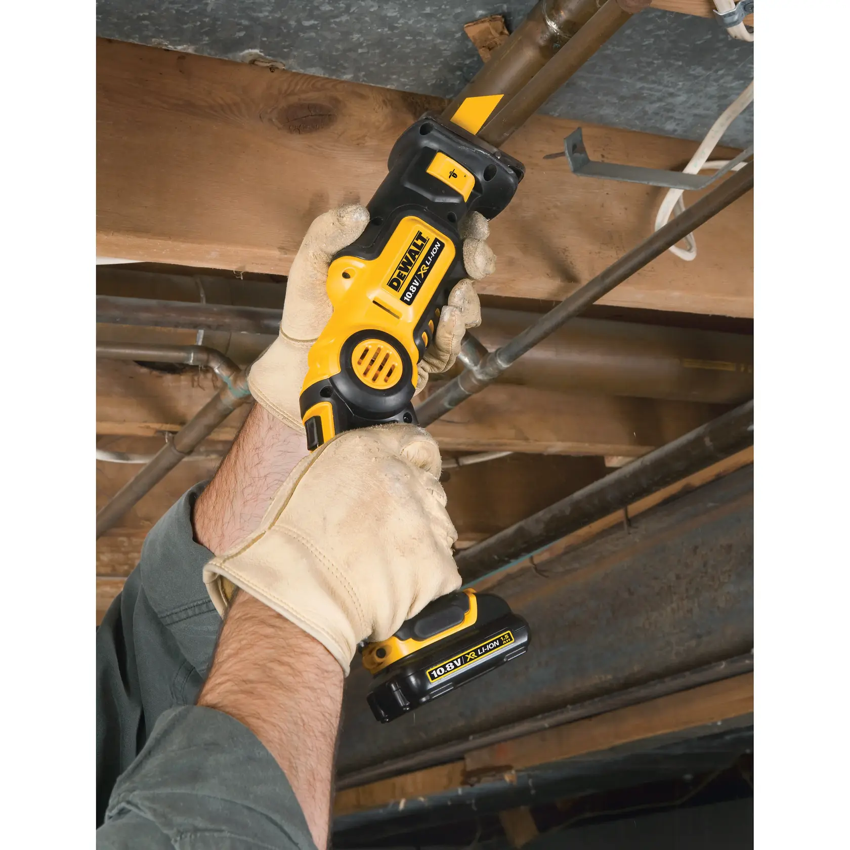 Photo of DEWALT cordless tool in use, black/yellow, SKUs DT2361-QZ, DT2361, close-up of gloved hands working.