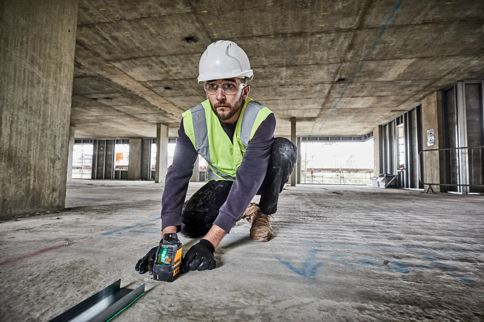 DEWALT DW088CG green cross line laser level with yellow and black casing, side view, power buttons visible.