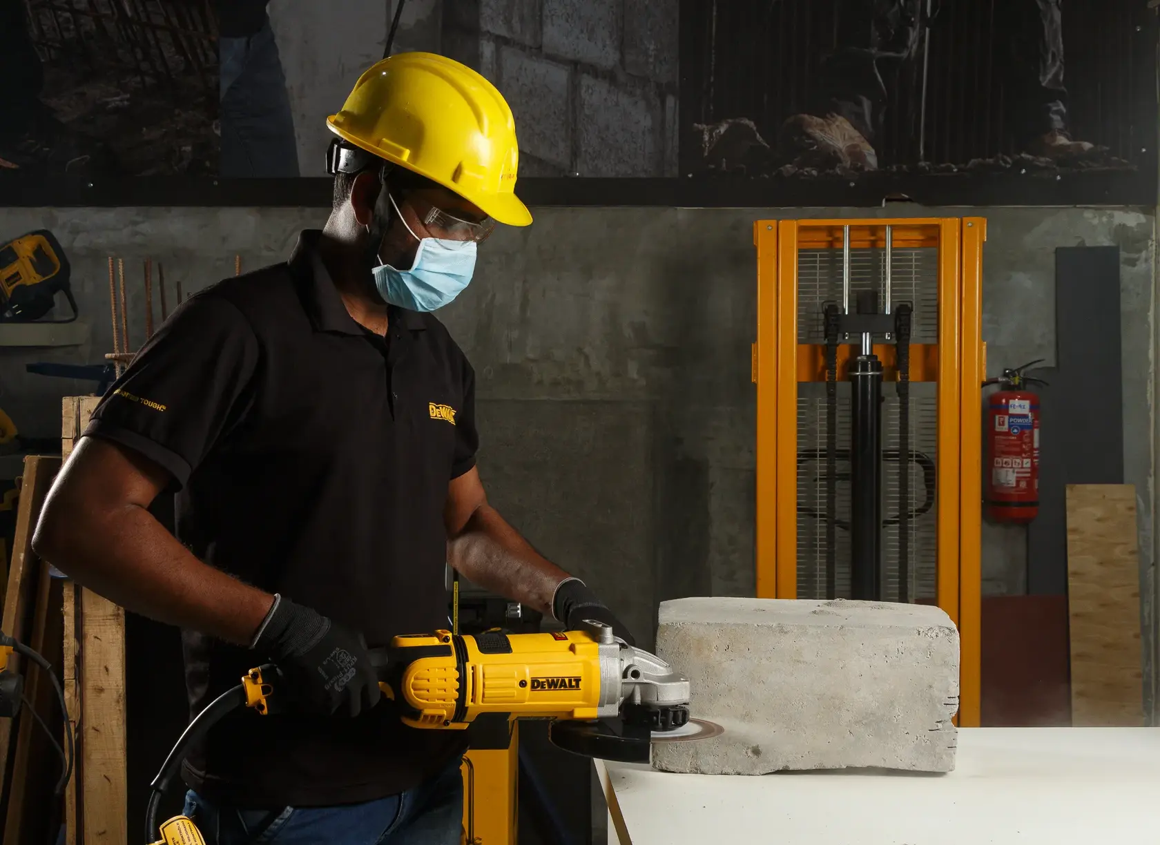 Photo of DEWALT grinder used on concrete, SKUs DWE4579-HM, DWE4579-AR, DWE4579-B2, DWE4579-B2C, DWE4579-B3, DWE4579.