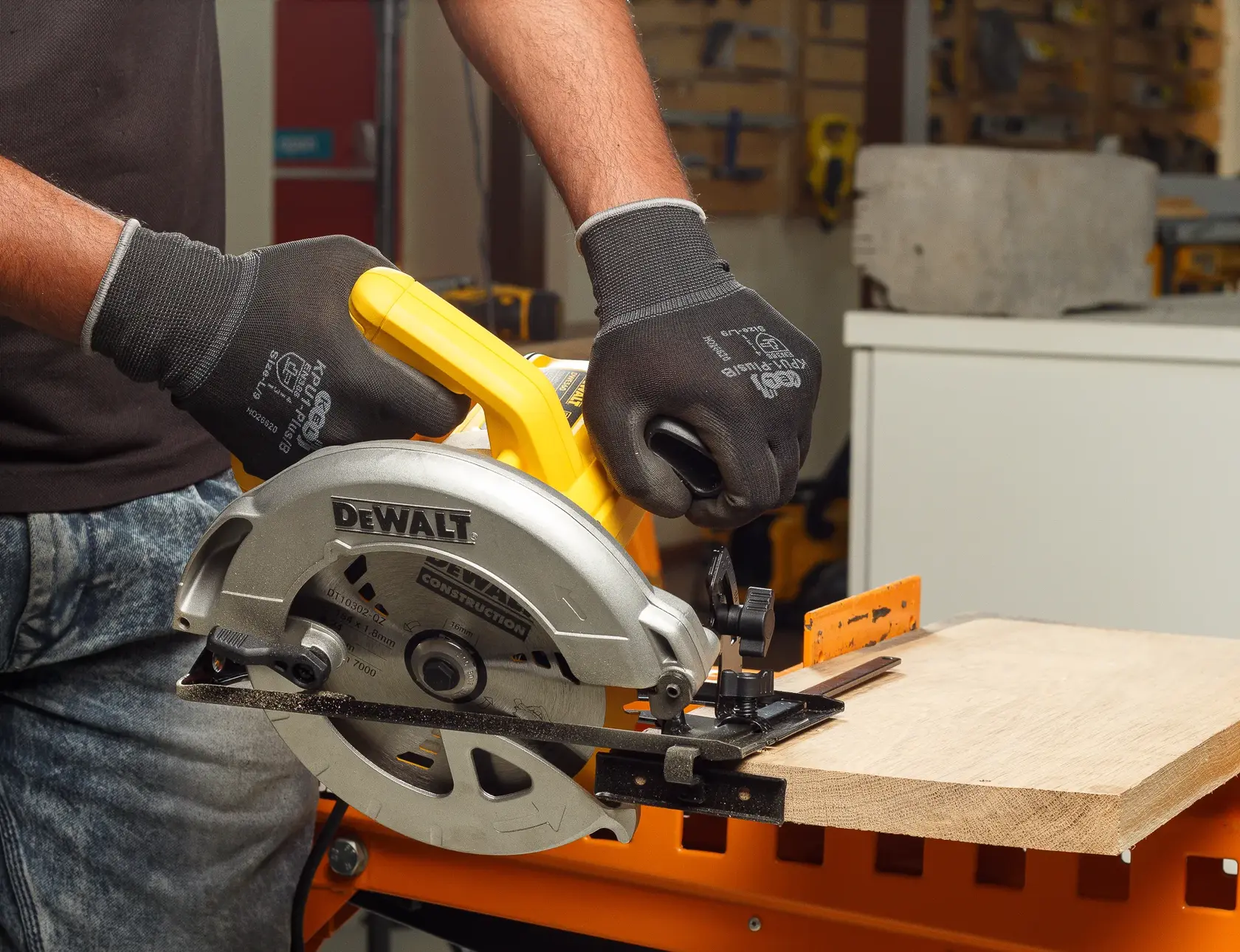 Photo of DEWALT circular saw cutting wood, DT10302-QZ and DT10302 SKU, closeup of tool and gloved hands.