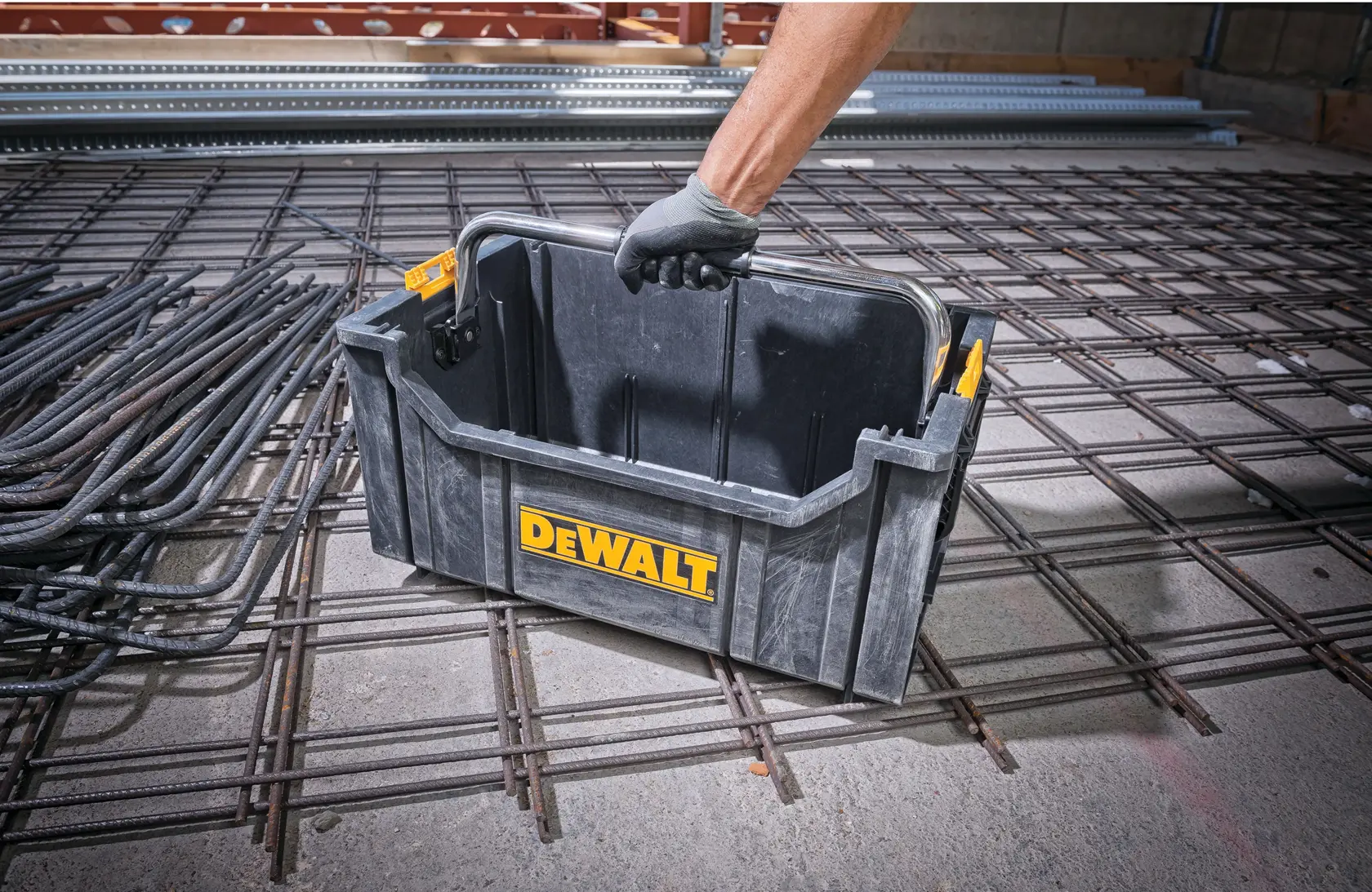 DEWALT ToughSystem 2.0 promotional graphic with the slogan 'Storage Built to Handle It' in large, bold yellow lettering on a dark, textured background.