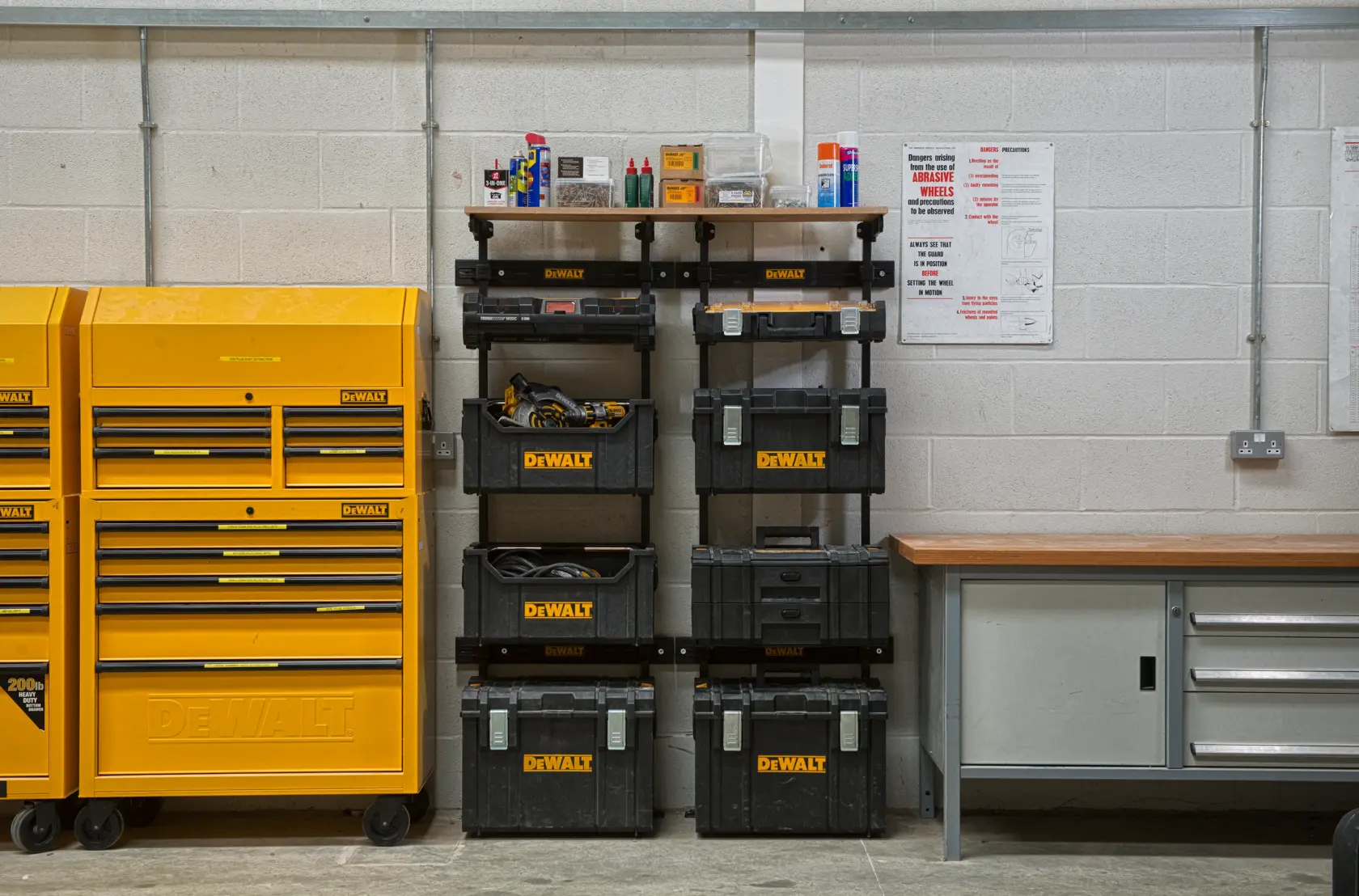 DEWALT ToughSystem 2.0 promotional graphic with the slogan 'Storage Built to Handle It' in large, bold yellow lettering on a dark, textured background.